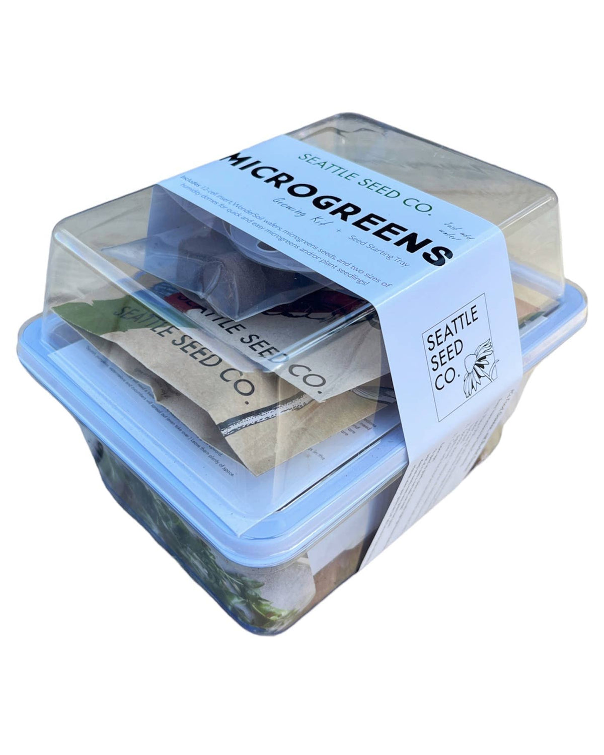 Container of Seattle Seed Co. microgreens with a clear lid on a white background