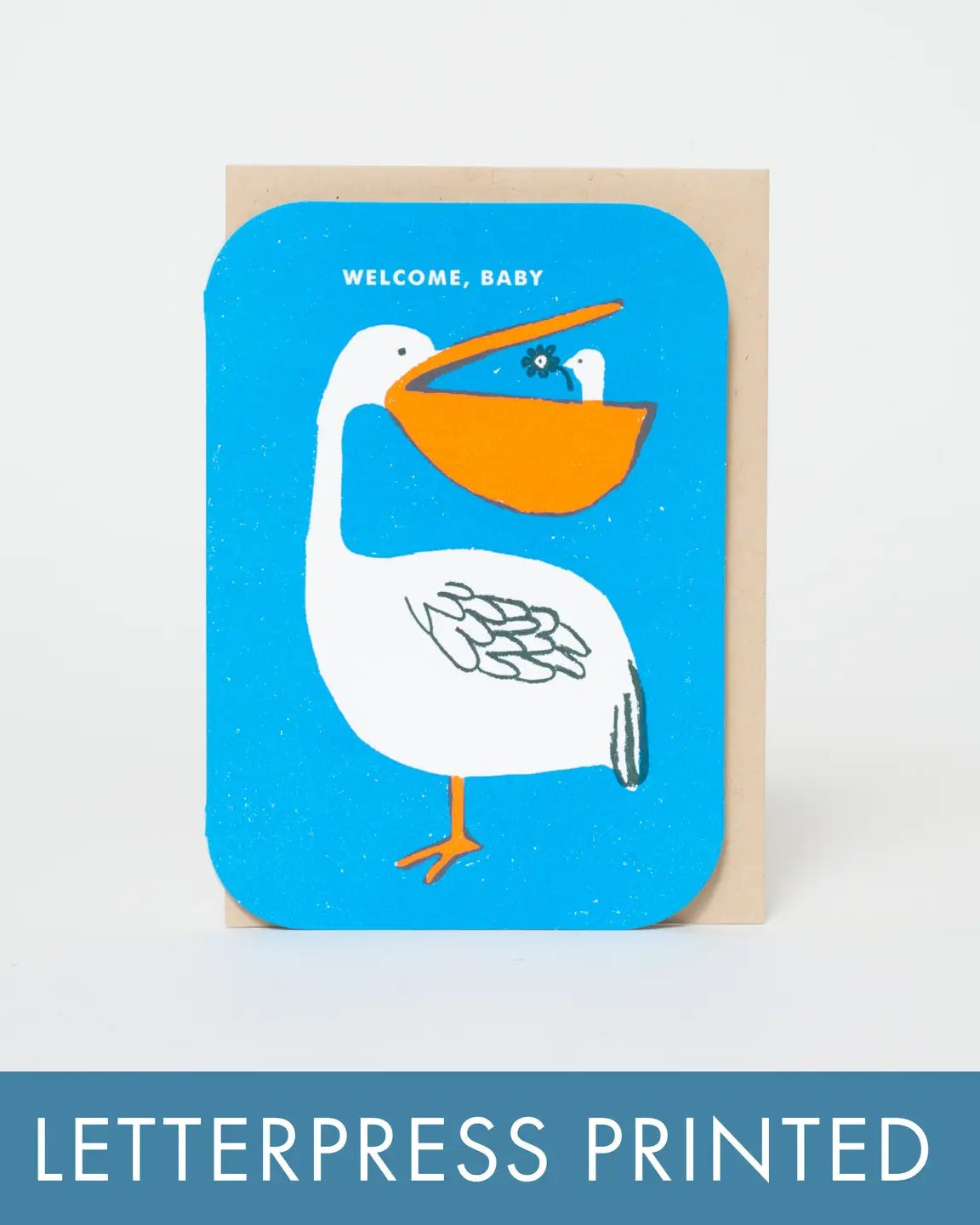 Greeting card with a pelican illustration and 'Welcome, Baby' text on a blue background.