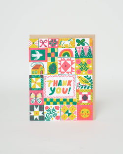 A card with illustrations to look like a quilt and the words "Thank you!" in the center