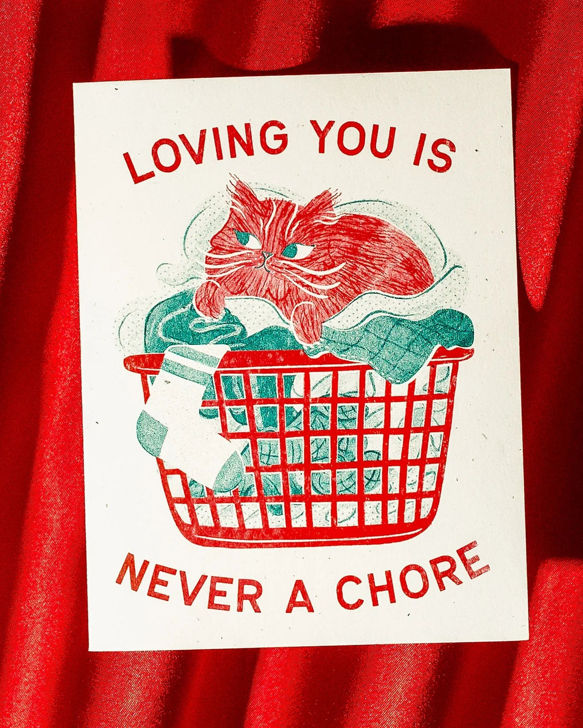 Card with a red cat illustration and text 'Loving you is never a chore' on a red background