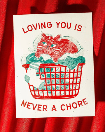 Card with a red cat illustration and text 'Loving you is never a chore' on a red background