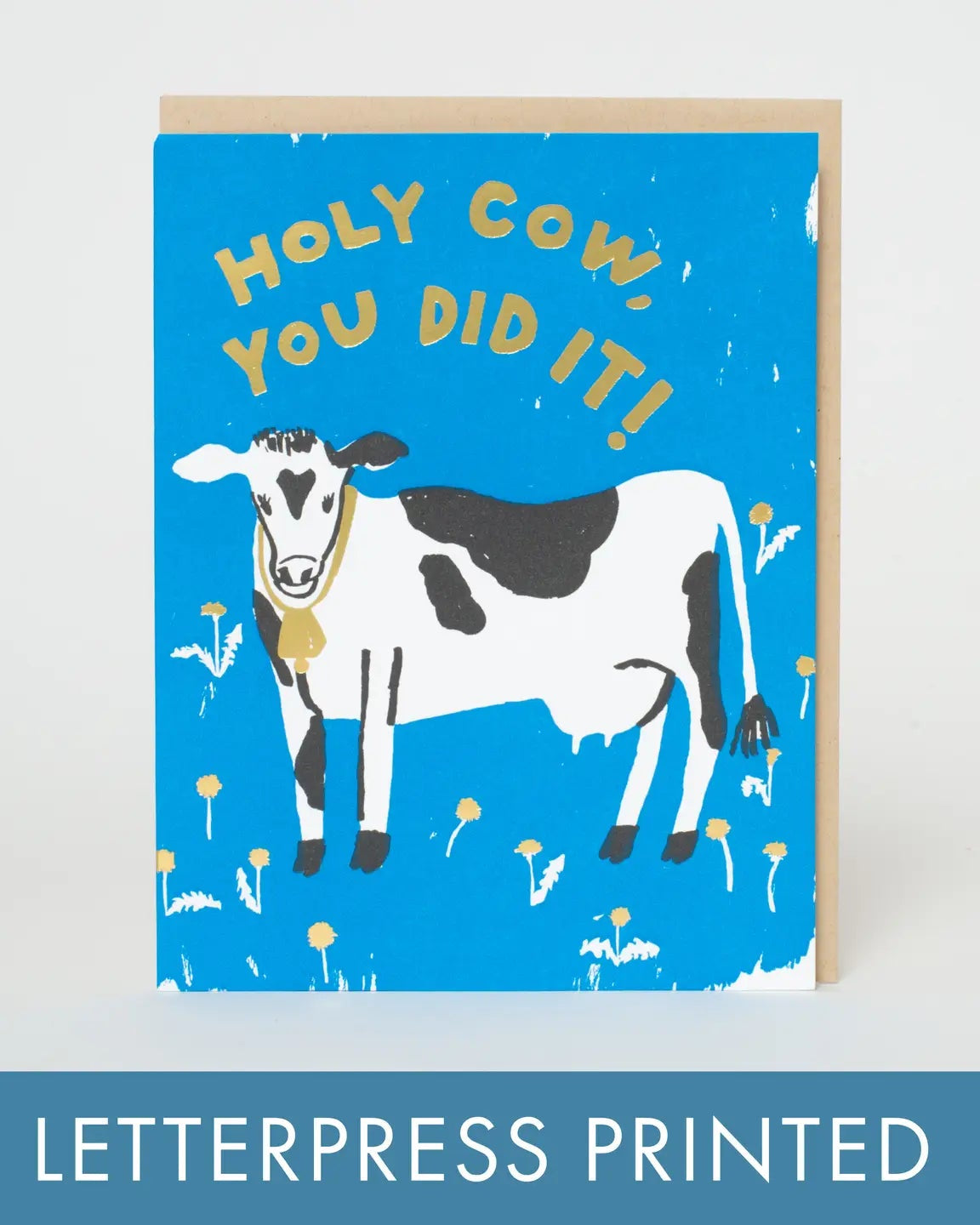 Greeting card with a cow illustration and text on a blue background