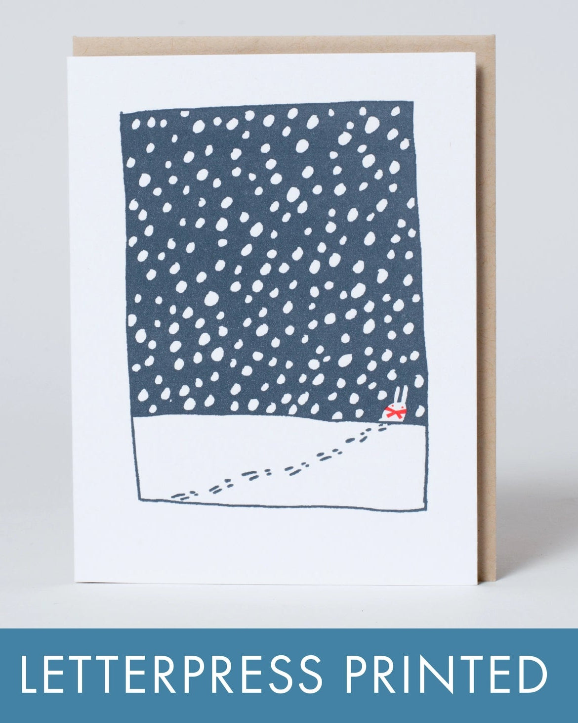 Letterpress printed card with blue and white pattern on a white background