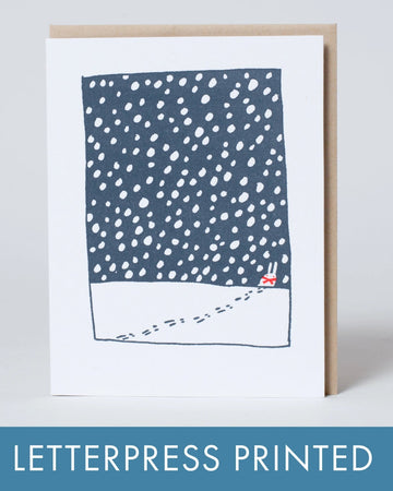 Letterpress printed card with blue and white pattern on a white background