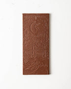 Chocolate bar with intricate design on a white background