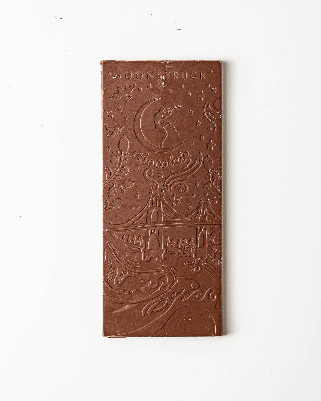 Chocolate bar with intricate design on a white background
