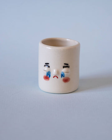 tiny face planter with crying face