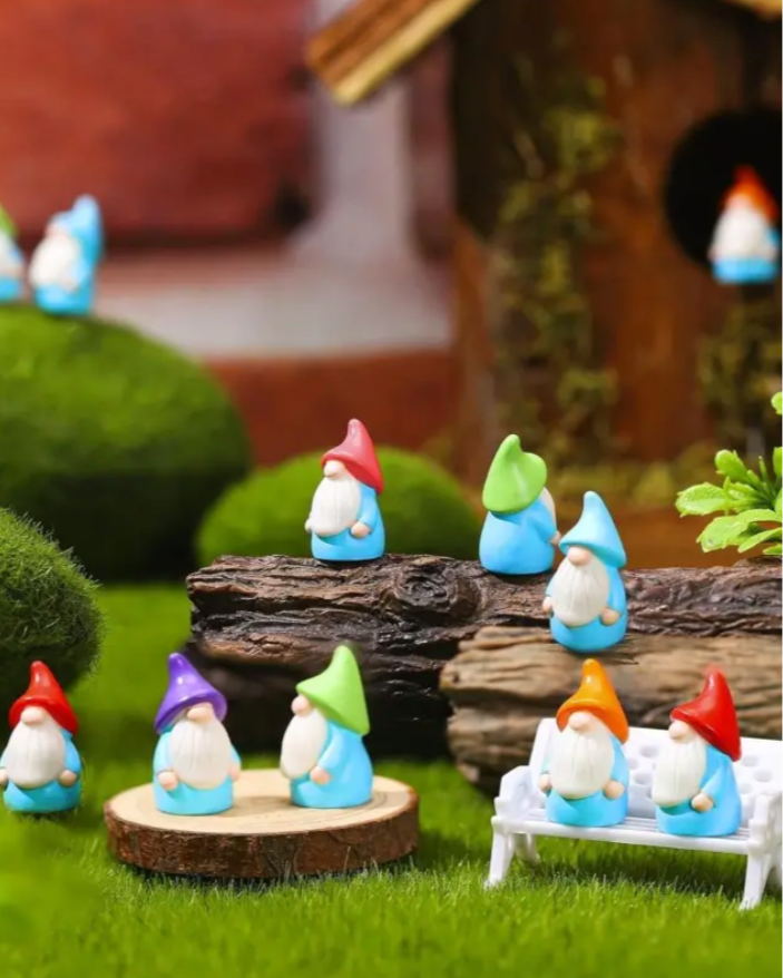 colorful gnome figurines in a miniature landscape