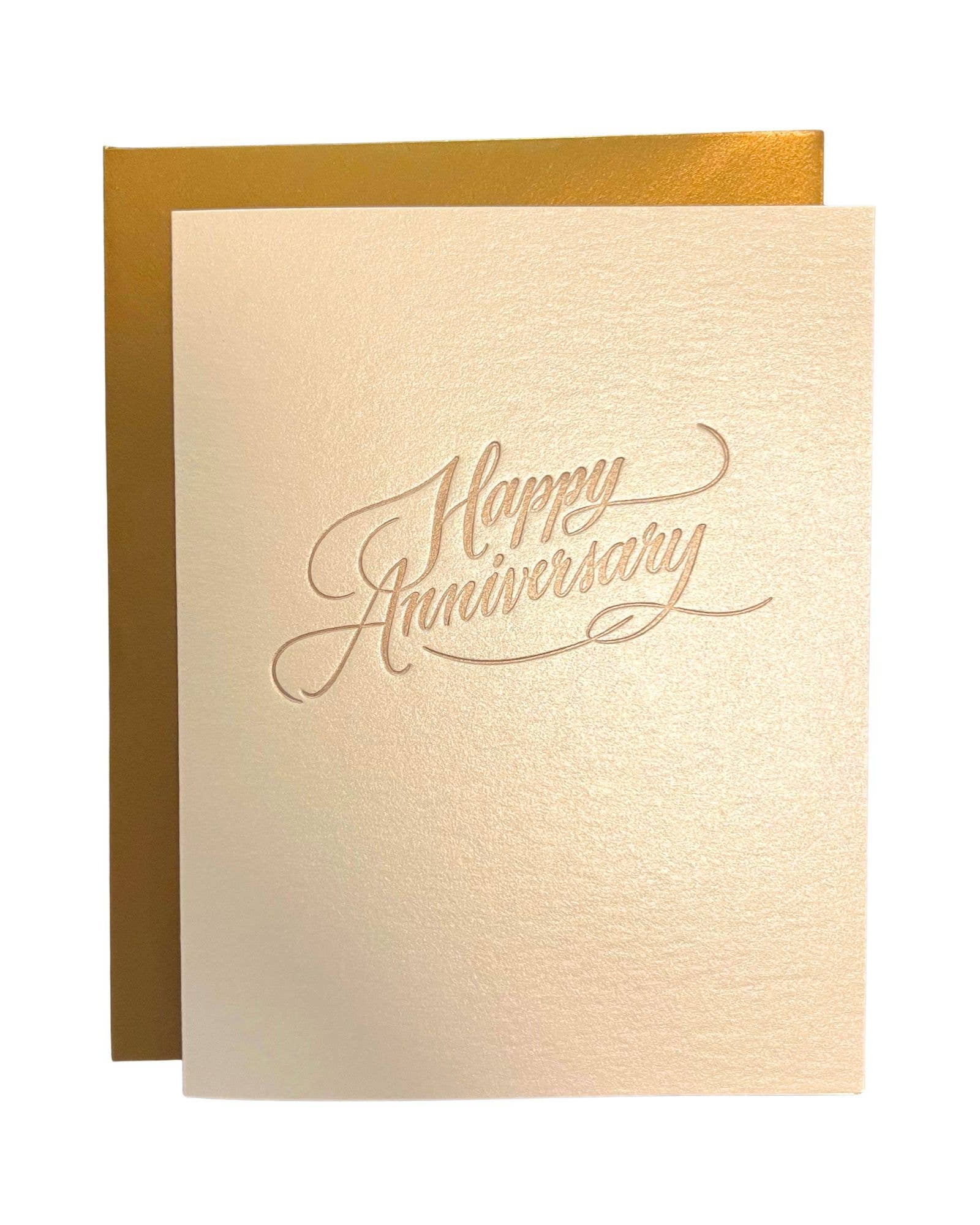 Greeting card with 'Happy Anniversary' text on beige paper with gold border