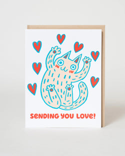 Card with a cartoon cat and hearts design on a white background
