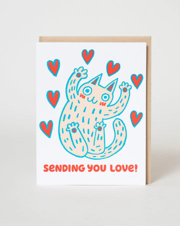 Card with a cartoon cat and hearts design on a white background