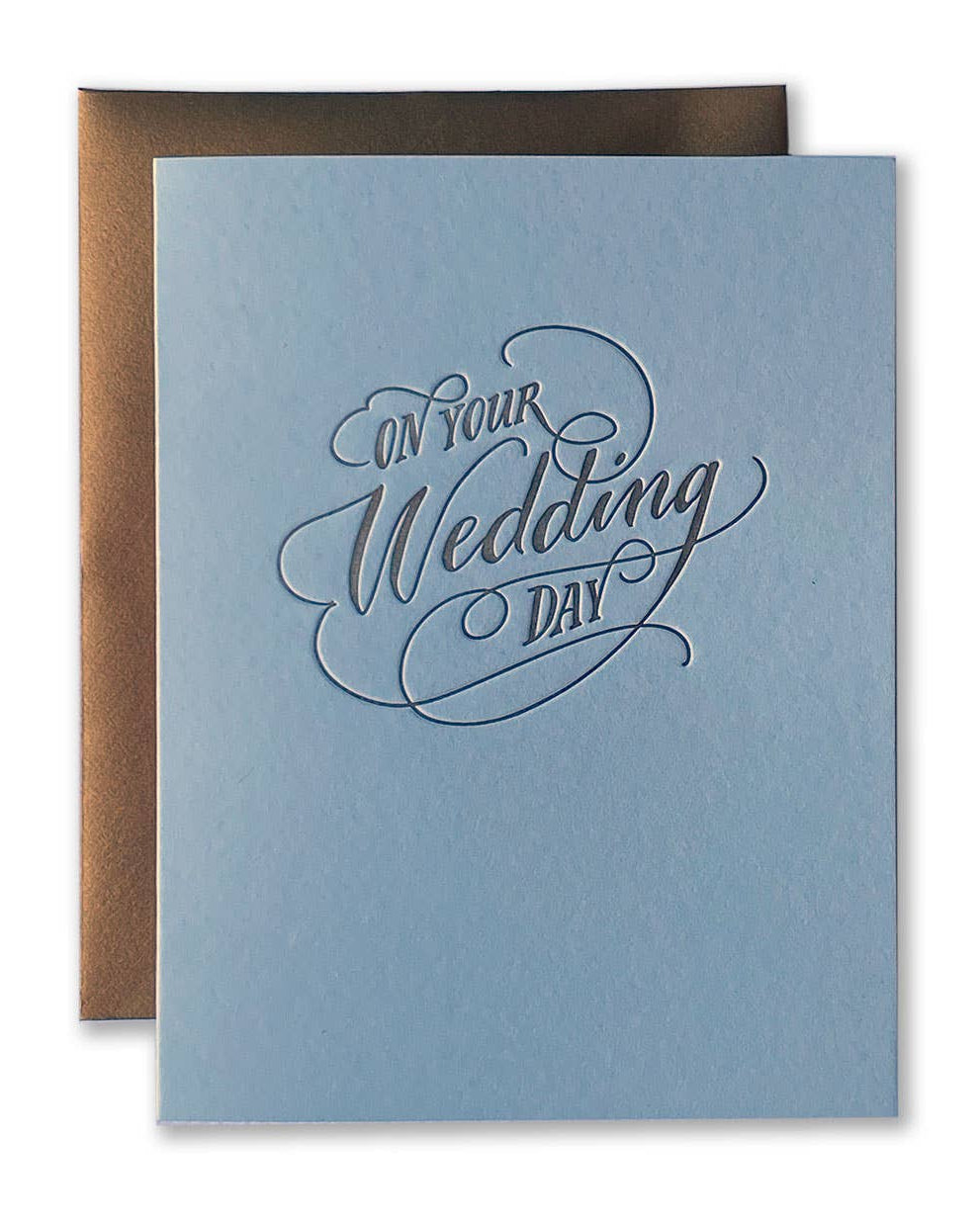 Blue card with 'On Your Wedding Day' text and brown envelope