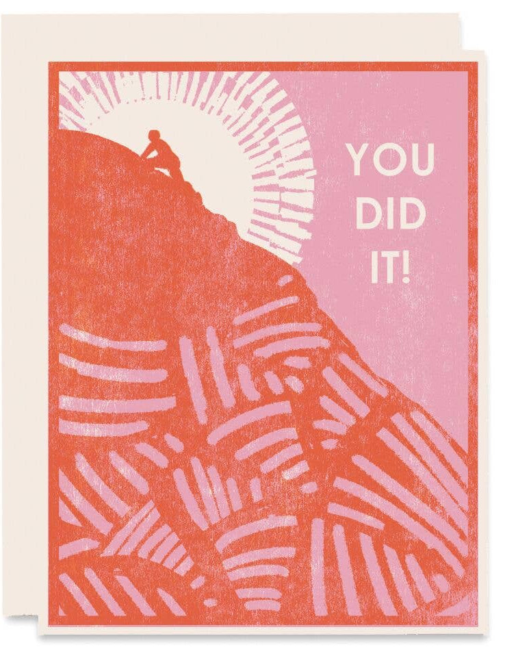Greeting card with a red and orange geometric pattern and the text 'YOU DID IT' on the front